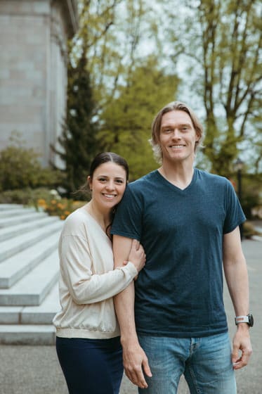 Parents posing in a sweater and t-shirt for their spring family pictures